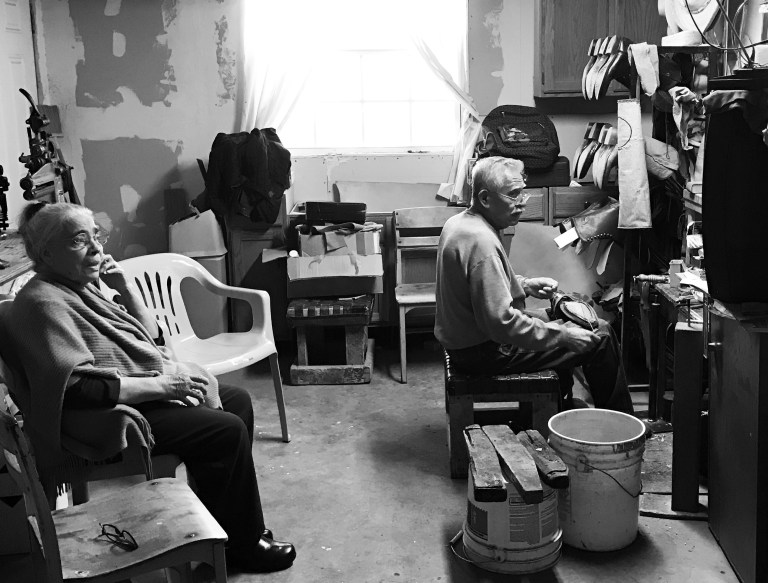 This 2017 photo was taken shortly before Lilia Cruz passed away. Depicted in the photo was their daily routine; Lilia would sit with Juan in his shop in the house while he inseamed, and they would watch old classic movies together. This 2017 photo was taken shortly before Lilia Cruz passed away. Depicted in the photo was their daily routine; Lilia would sit with Juan in his shop in the house while he inseamed, and they would watch old classic movies together.