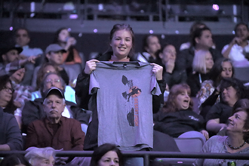 Mackenzie Wood holding up the Desert Flight t-shirt Mackenzie Wood holding up the Desert Flight t-shirt