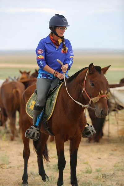 Heather Wallace prepares to ride in the Officials Race. © Gobi Desert Cup Heather Wallace prepares to ride in the Officials Race. © Gobi Desert Cup
