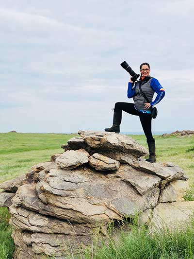 Media Consultant Heather Wallace looks for the best vantage point to photograph the riders. © Gobi Desert Cup Media Consultant Heather Wallace looks for the best vantage point to photograph the riders. © Gobi Desert Cup