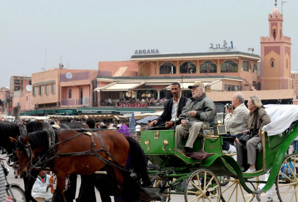 Tourists sit in a horse-drawn carriage next to the mosque Koutoubia in the touristic city of Marrakech (Photo: Getty) Tourists sit in a horse-drawn carriage next to the mosque Koutoubia in the touristic city of Marrakech (Photo: Getty)