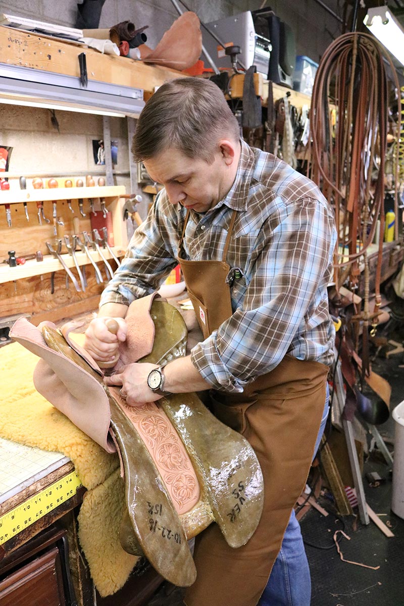 Bryan Oliver, 4th generation owner of Oliver Saddle Shop, working on a saddle. Bryan Oliver, 4th generation owner of Oliver Saddle Shop, working on a saddle