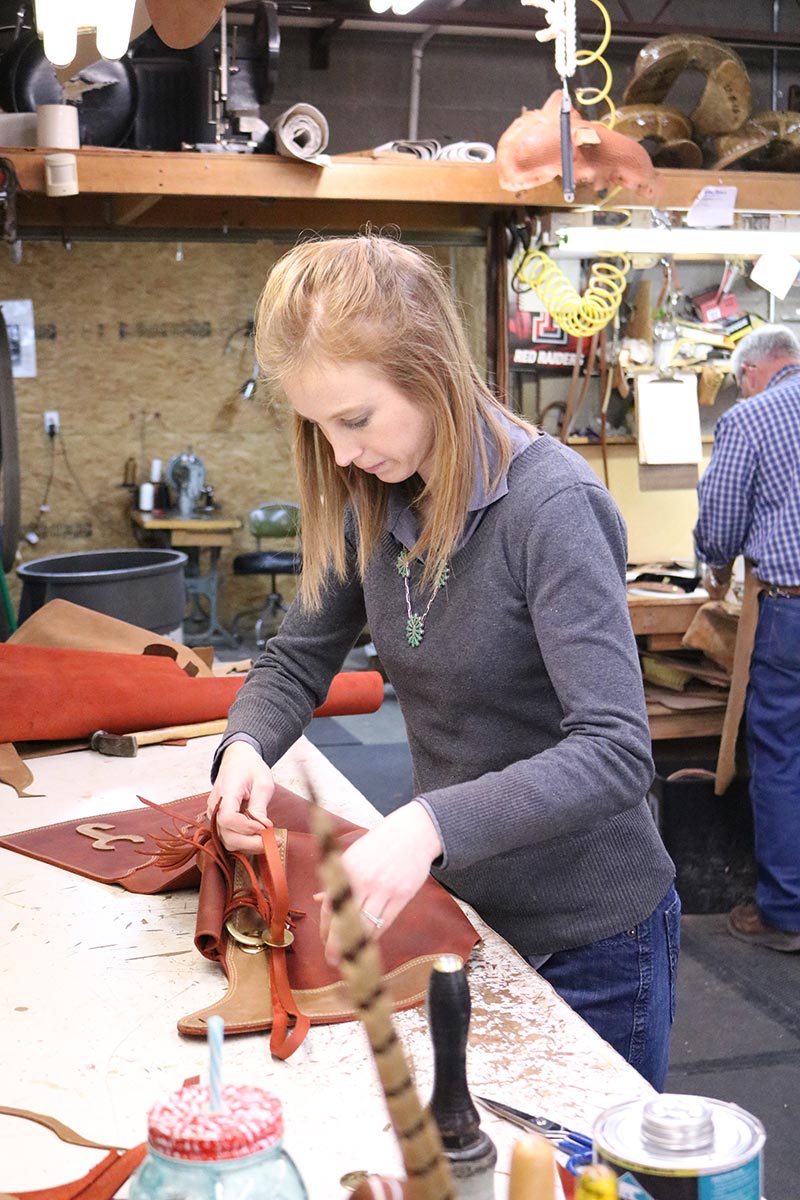 Hannah Mills finishing up a pair of chaps Hannah Mills finishing up a pair of chaps