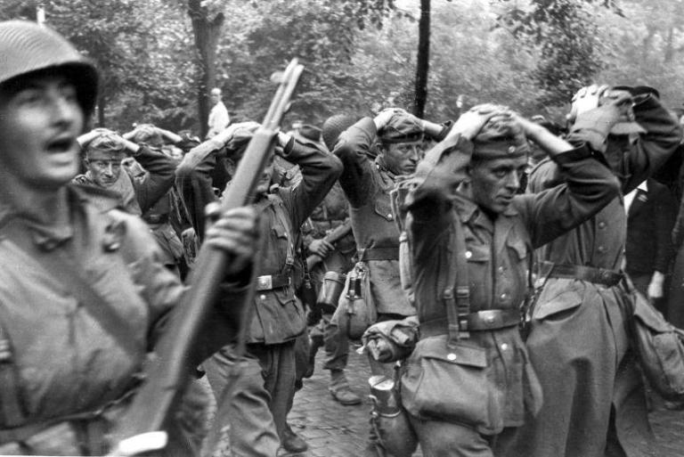 Surrendered German soldiers would be rearmed by the Americans to help defend the herd as it made for the American lines. (Image source: Flickr) Surrendered German soldiers would be rearmed by the Americans to help defend the herd as it made for the American lines. (Image source: Flickr)