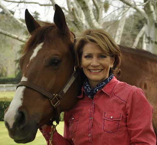 Debbie Loucks with the family's horse, Bunny, which is short for "Steel Buns." James Oliver